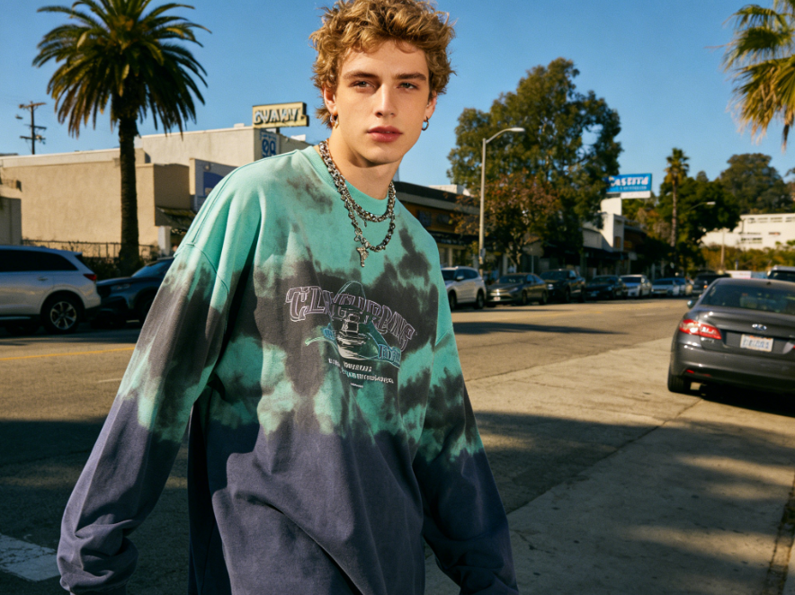 horizontal portrait of European youth in trendy streetwear, outdoor scene with natural light, original picture for AI clothing replacement