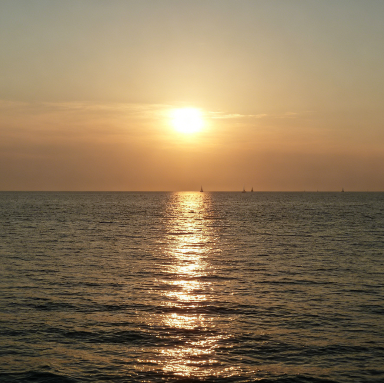 AI lens flare removal effect on European seaside sunset photo, strong lens flare eliminated under warm sunset light, restoring true color layers of sunset and sea, transparent and natural image with clear details
