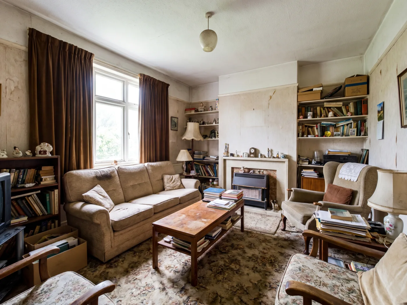Cluttered living room with outdated furniture before AI removal