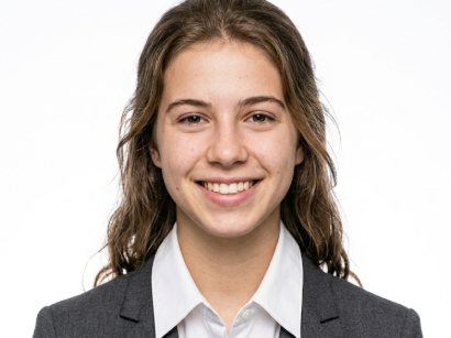 Frontal portrait of the same woman with neatly styled hair, now in a white collared shirt and dark gray blazer. Her expression is warm yet formal against a pure white background — clean, professional ID photo style.