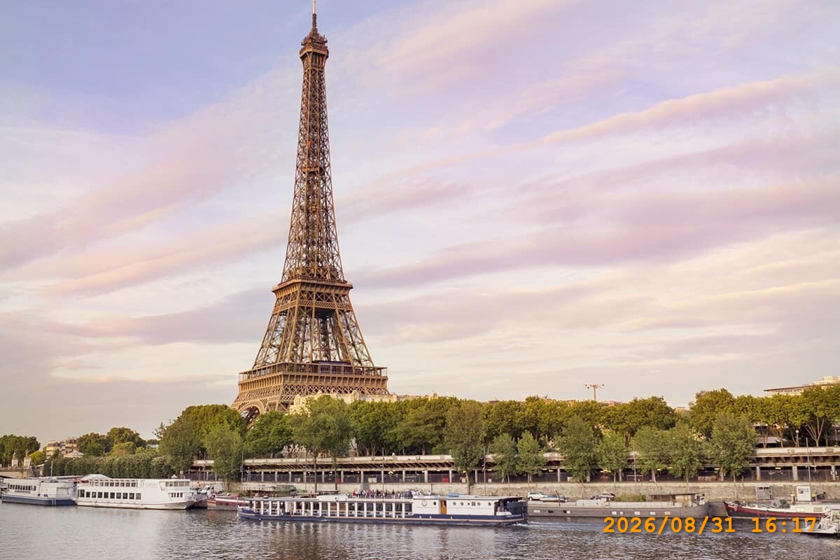 Eiffel Tower photo with a visible orange date and time stamp in the lower-right corner