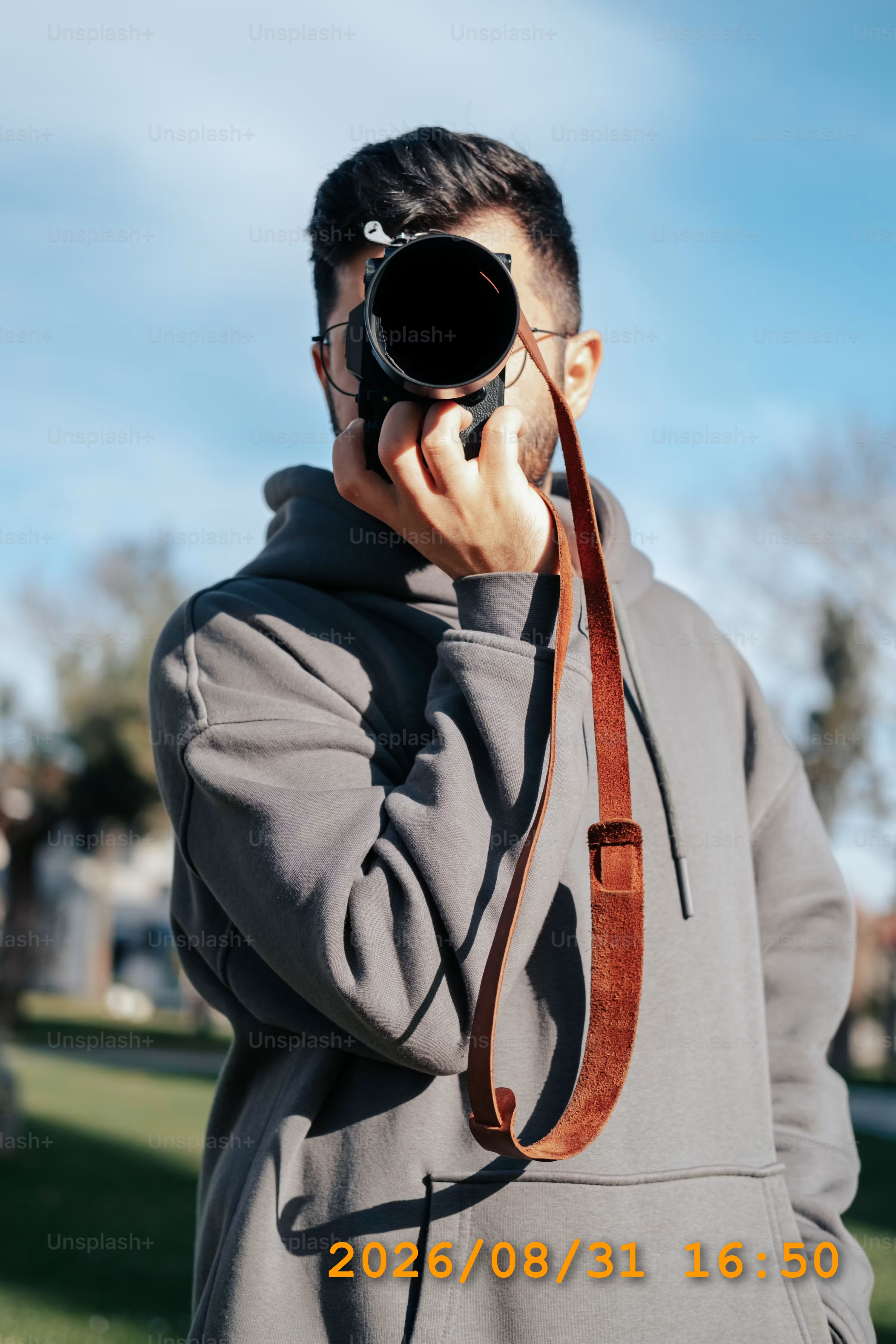 Photographer portrait with a visible orange date stamp