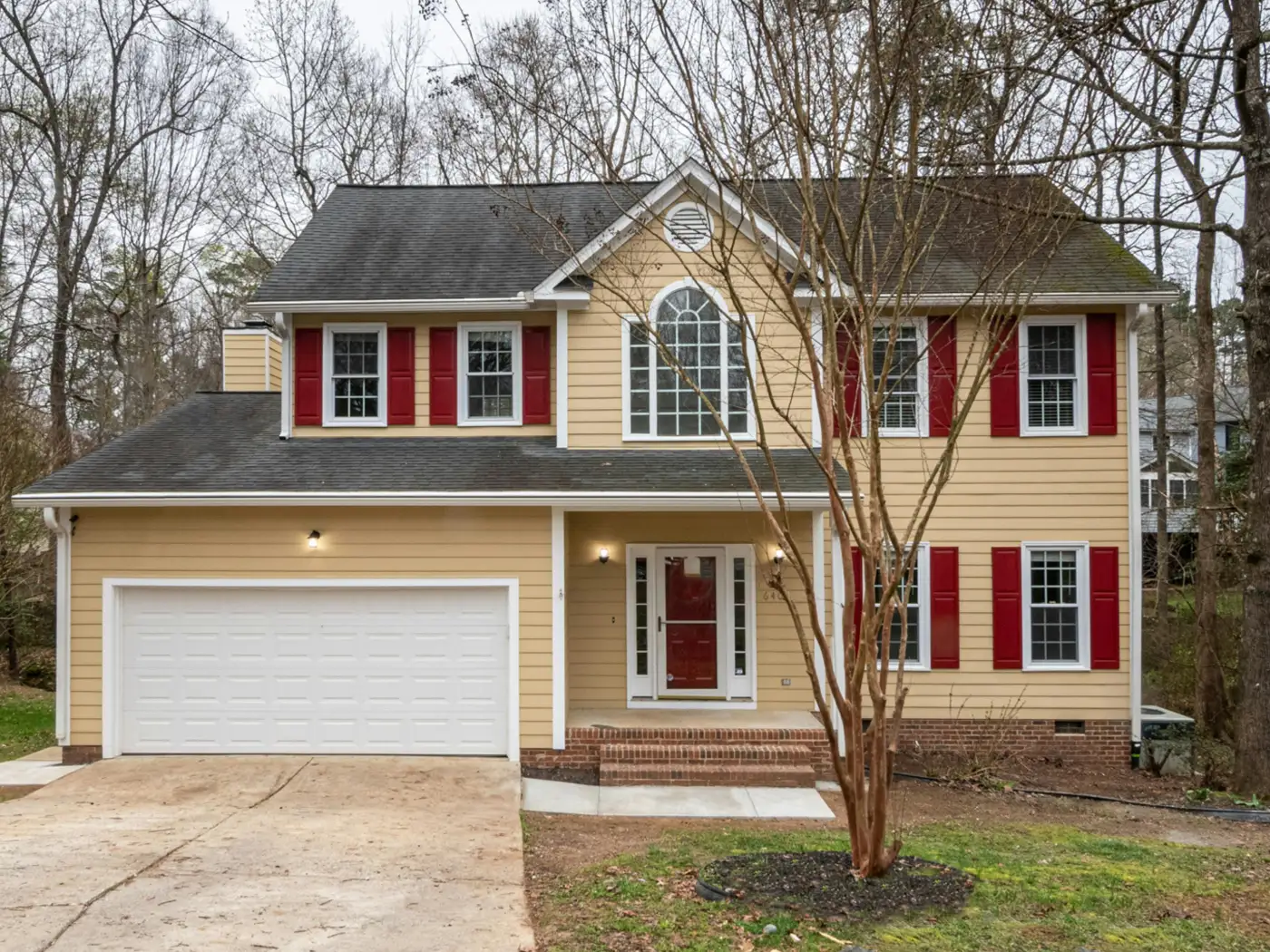 Plain suburban house exterior before redesign
