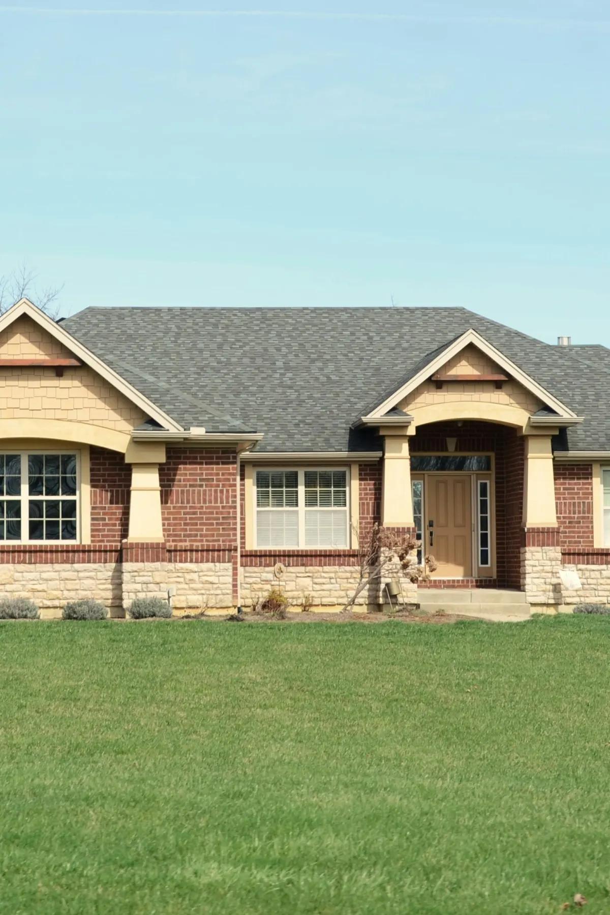 Plain yard and house frontage before landscape redesign