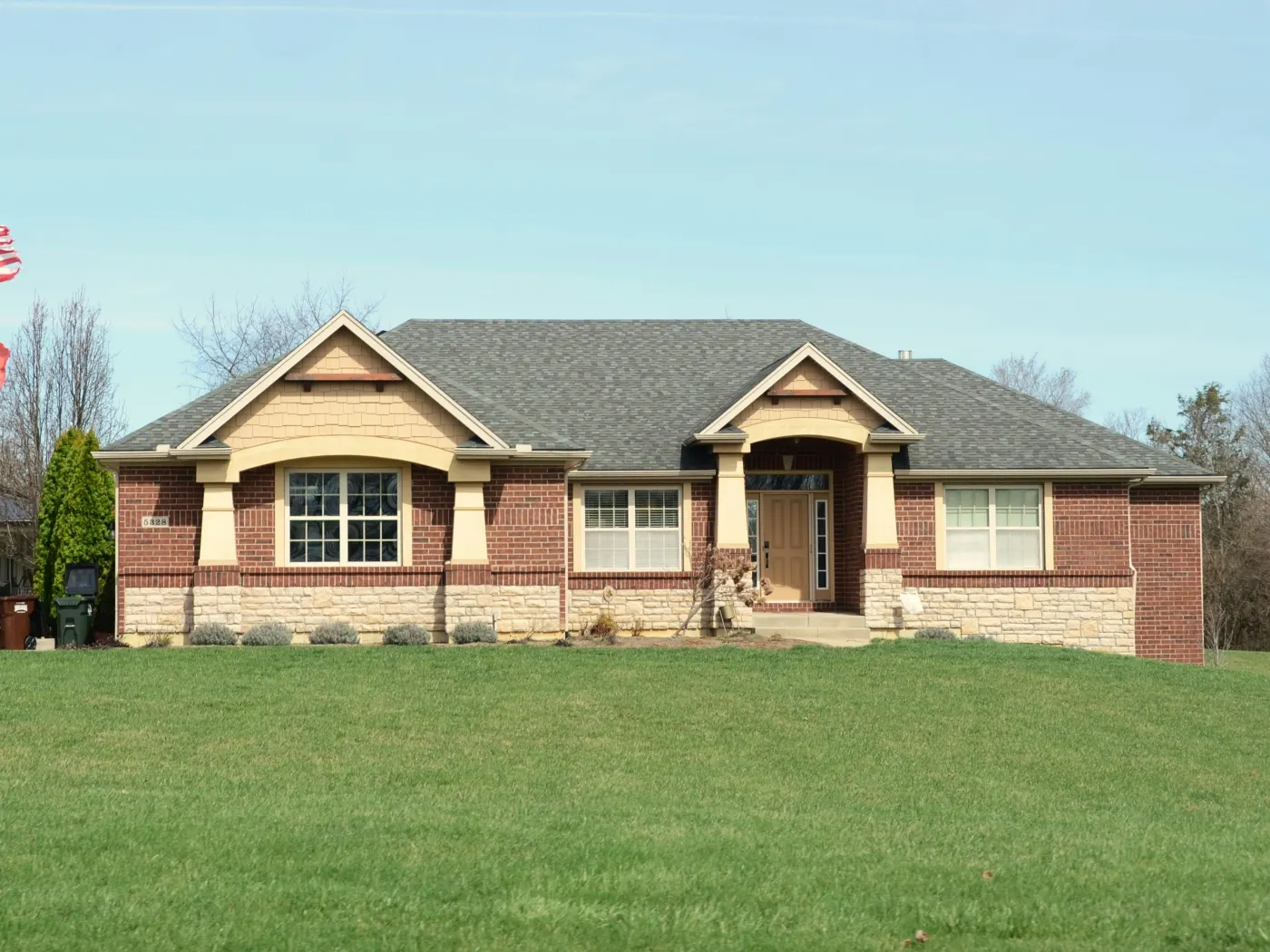 Plain yard and house frontage before landscape redesign