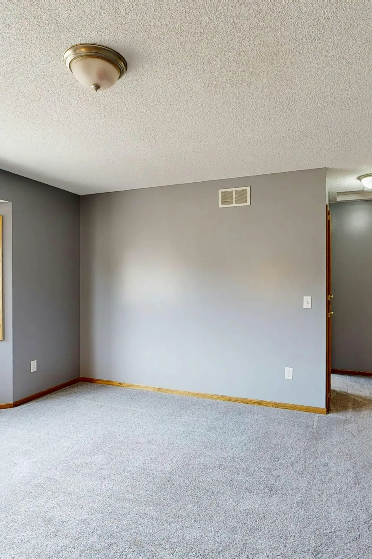 Empty living room before redesign