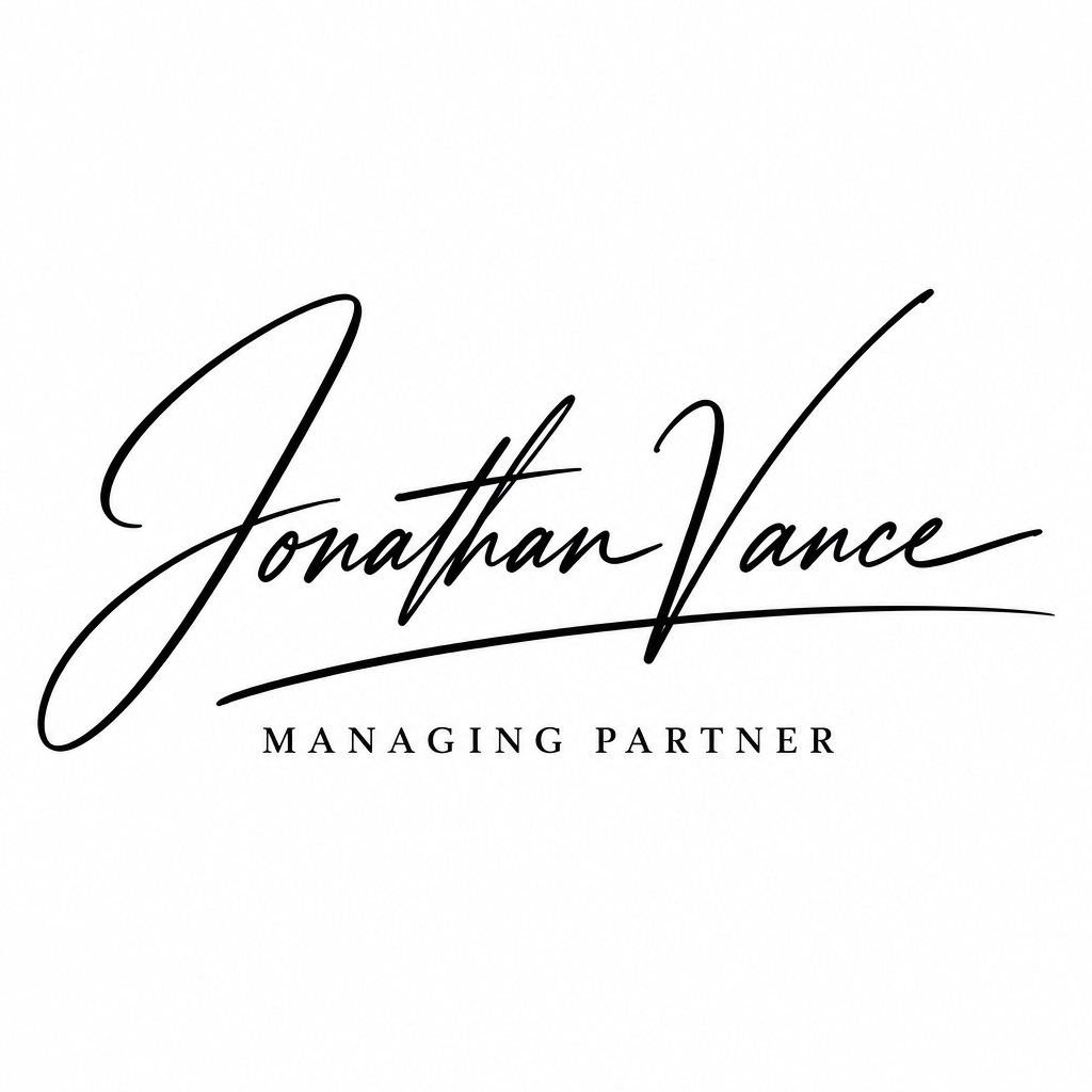 Bold executive signature for Jonathan Vance with a sharp underline flourish on white background.