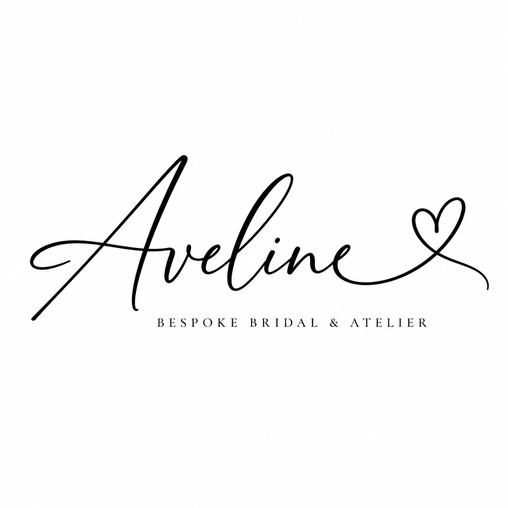 Black ink cursive signature Aveline terminating in a continuous heart loop on white background.
